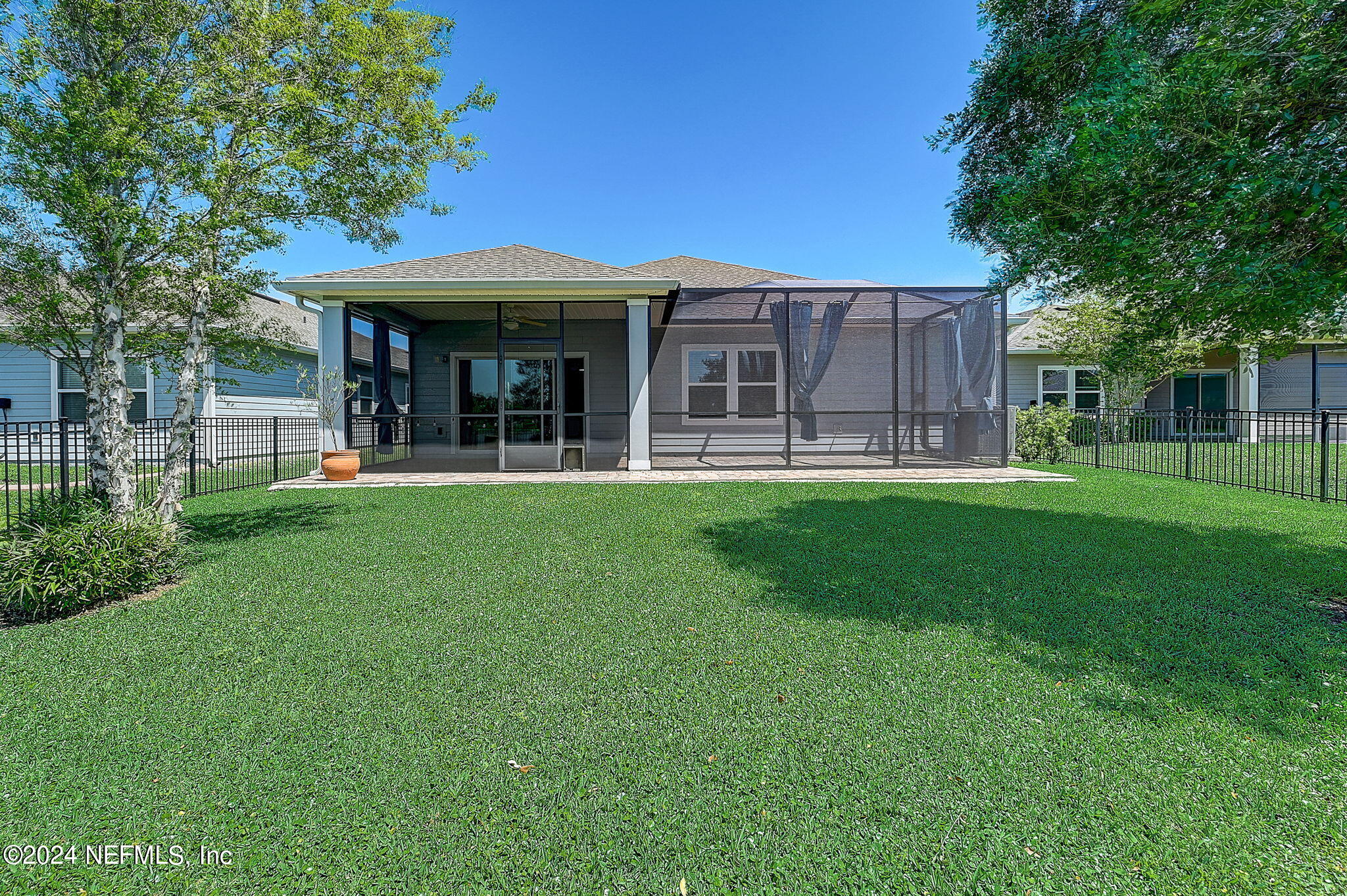 48 Martello Drive St. Augustine, FL 32092 - Photo 14 of 50 a front view of a house with a garden and porch