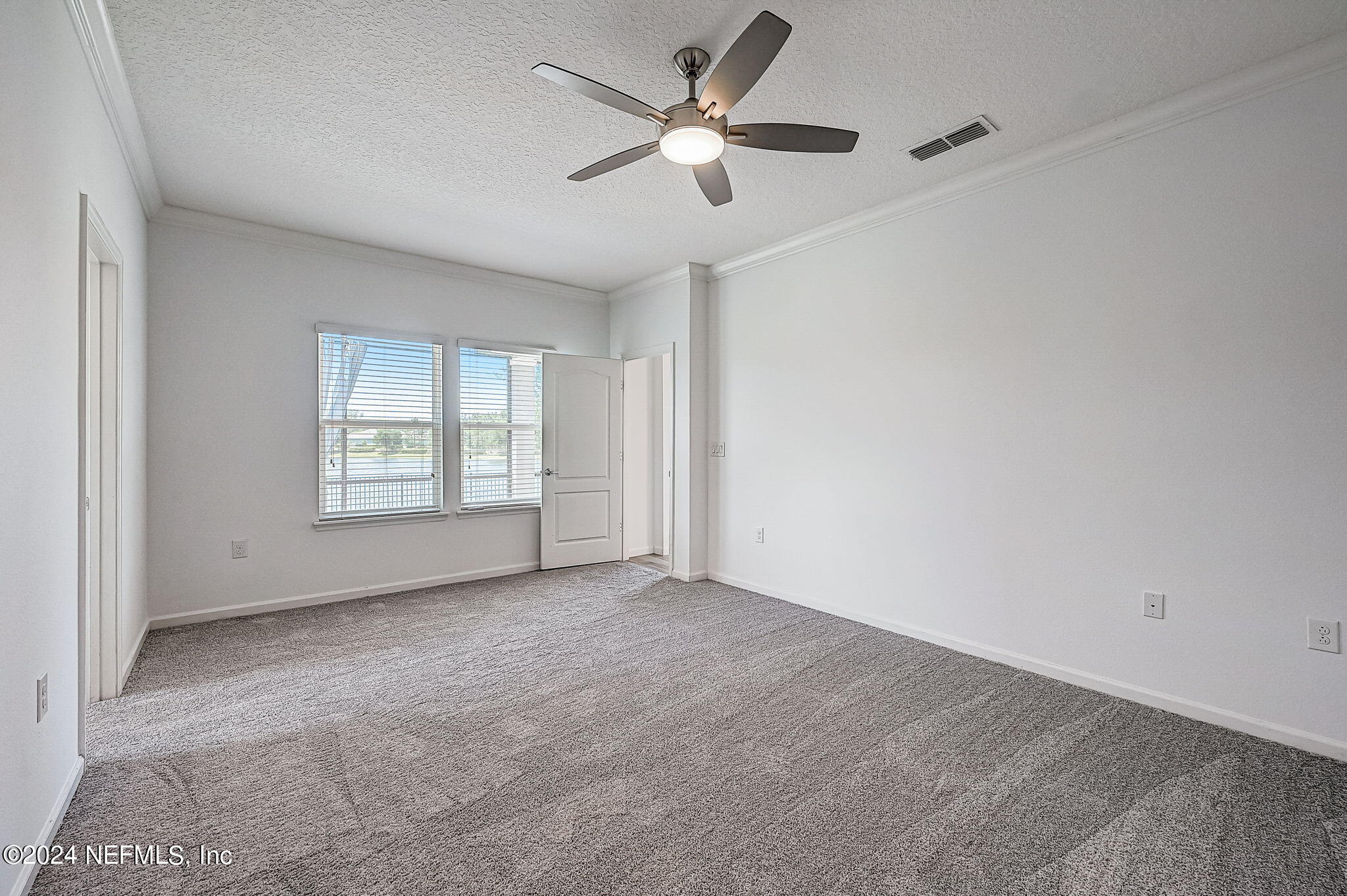 48 Martello Drive St. Augustine, FL 32092 - Photo 16 of 50 an empty room with windows and fan