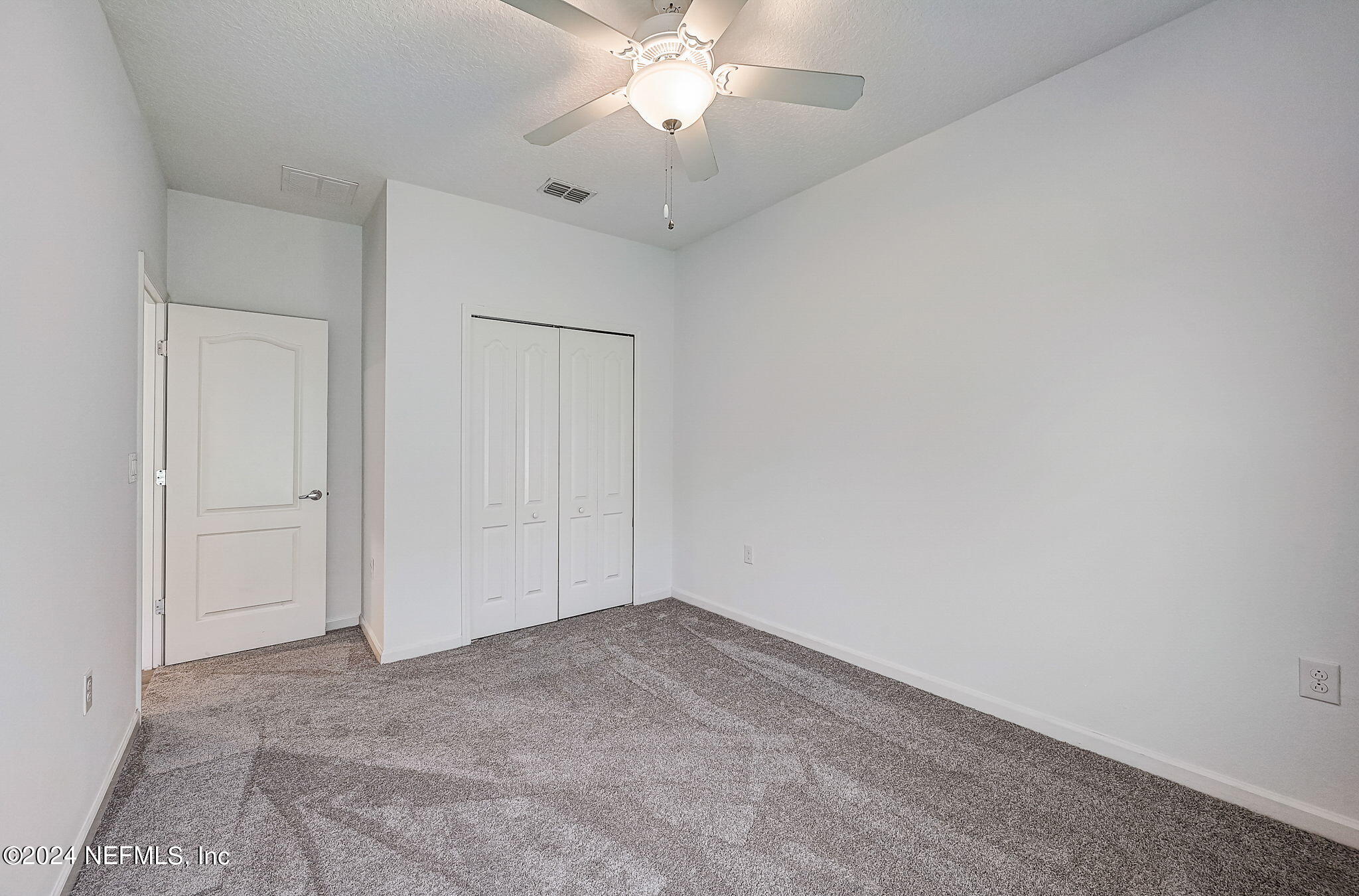 48 Martello Drive St. Augustine, FL 32092 - Photo 21 of 50 an empty room with chandelier fan and entryway