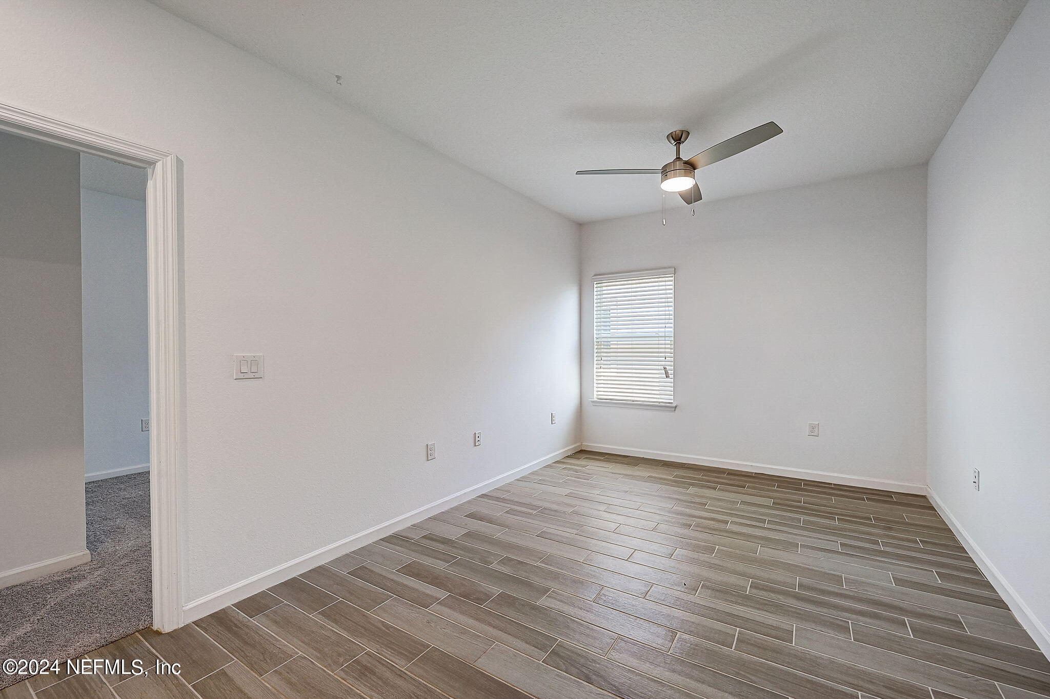 48 Martello Drive St. Augustine, FL 32092 - Photo 26 of 50 an empty room with wooden floor and ceiling fan