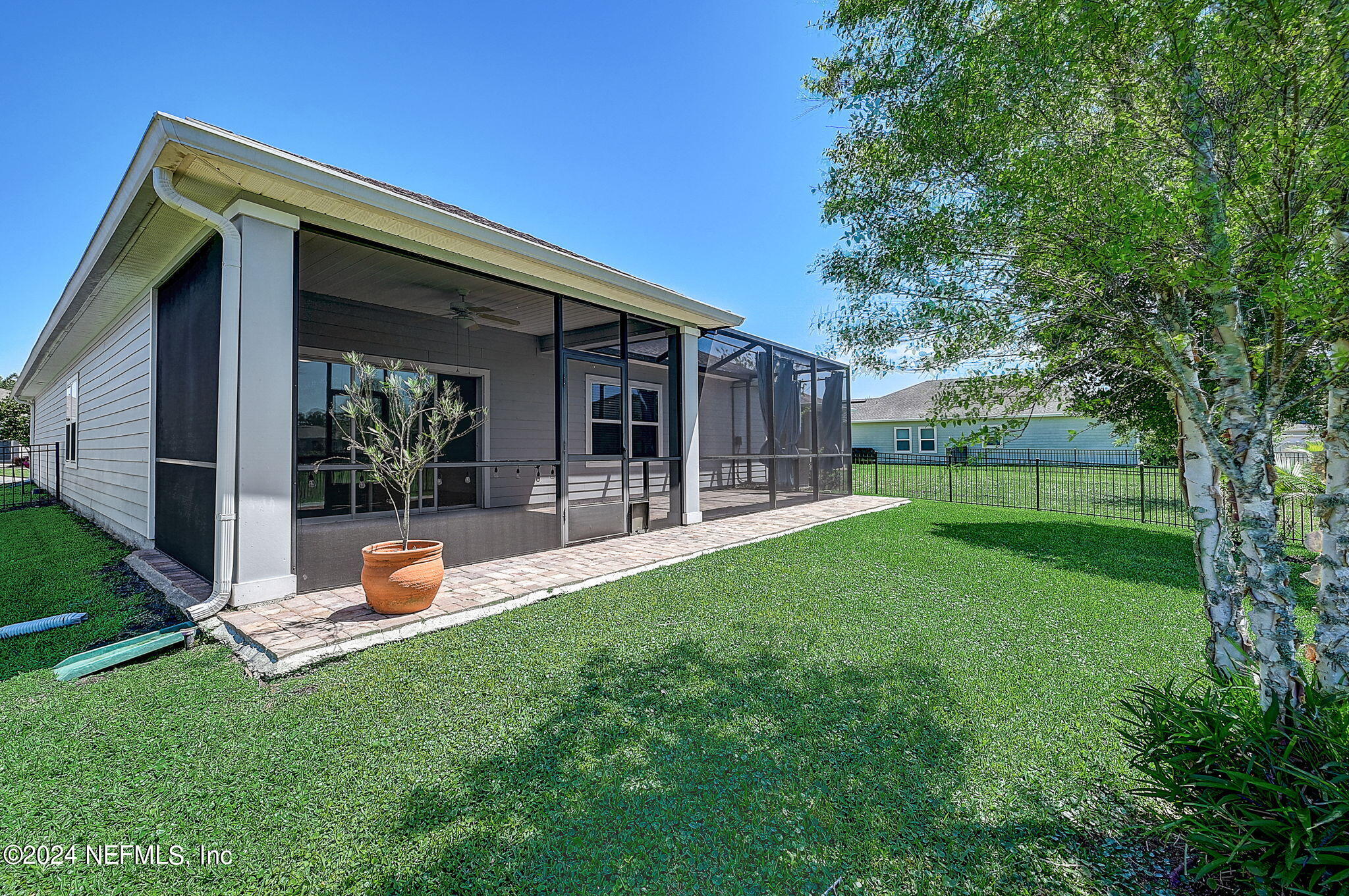 48 Martello Drive St. Augustine, FL 32092 - Photo 29 of 50 a view of a backyard with table and chairs and garden