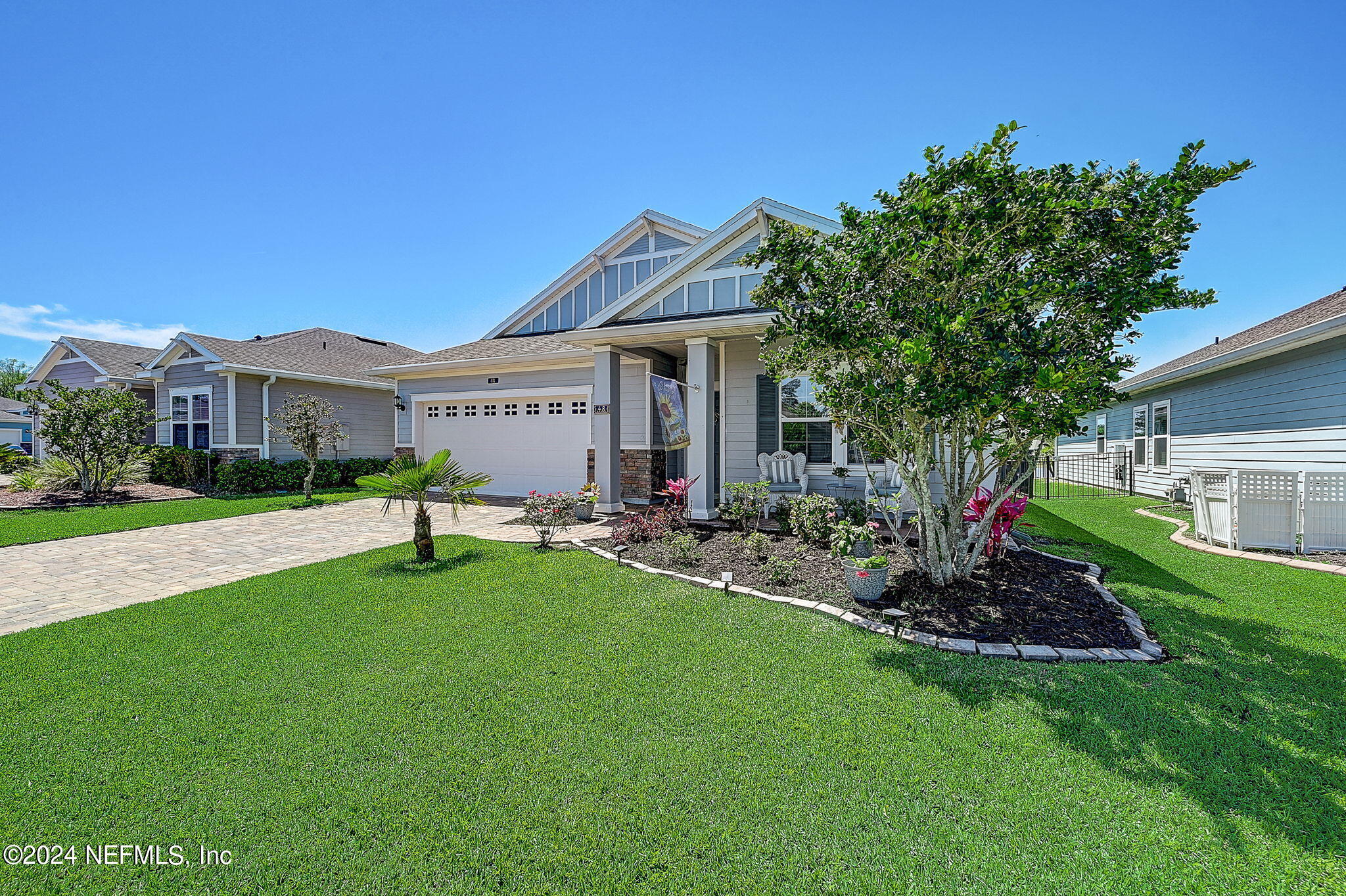 48 Martello Drive St. Augustine, FL 32092 - Photo 39 of 50 a front view of a house with a yard and tree