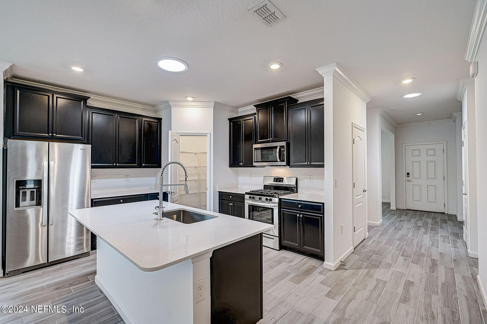 48 Martello Drive St. Augustine, FL 32092 - Photo 5 of 50 a kitchen with cabinets a sink and stainless steel appliances