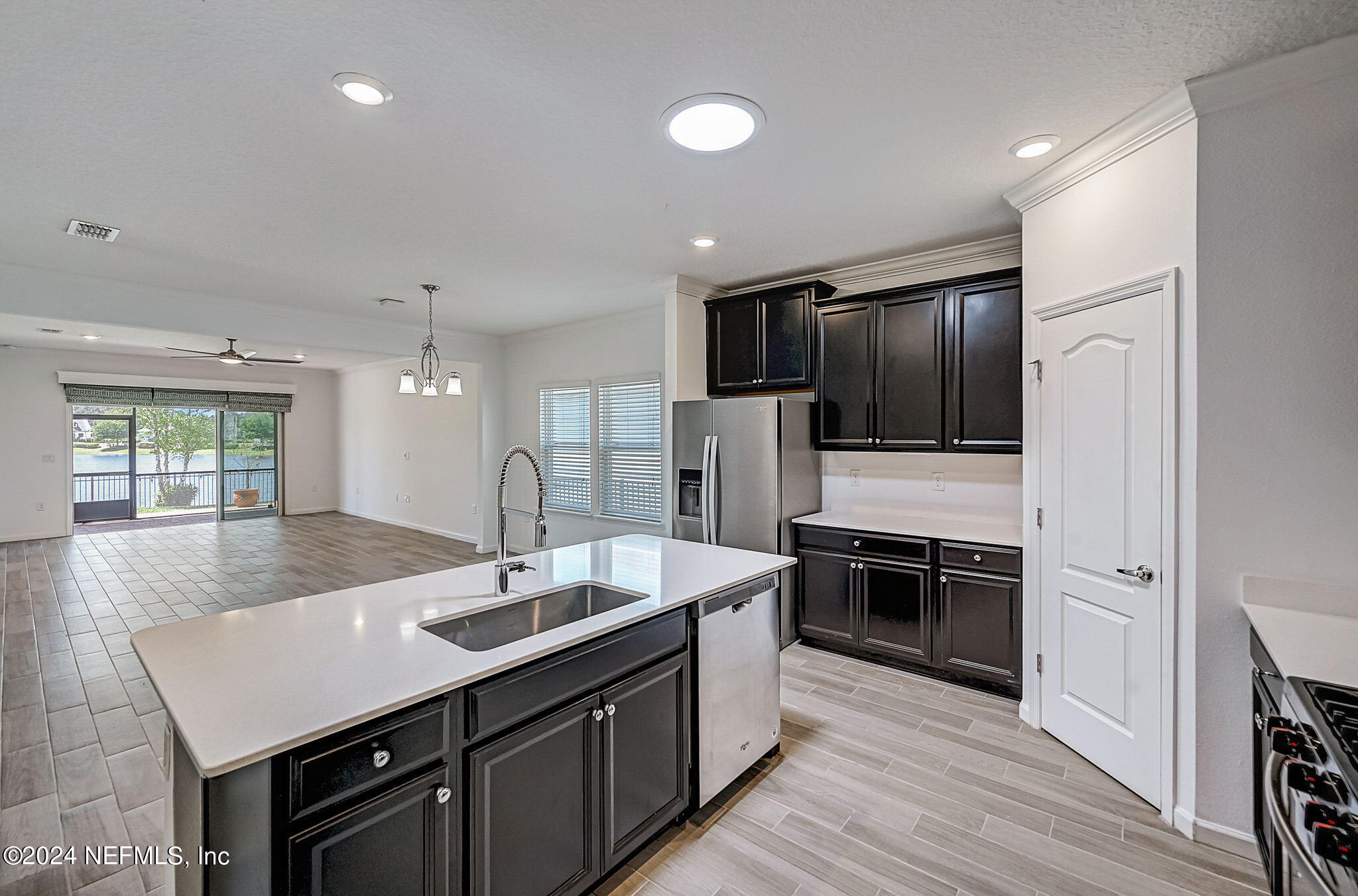 48 Martello Drive St. Augustine, FL 32092 - Photo 6 of 50 a kitchen with stainless steel appliances granite countertop a sink stove and refrigerator