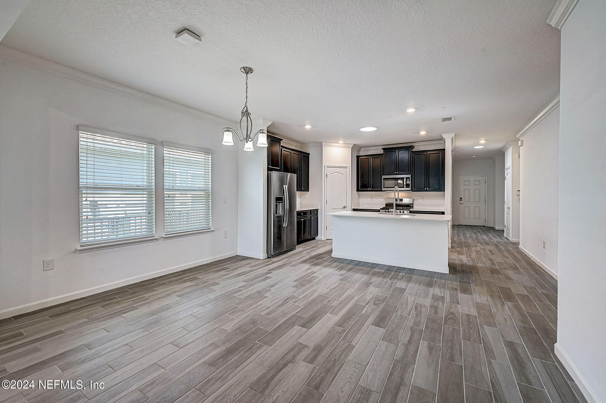48 Martello Drive St. Augustine, FL 32092 - Photo 8 of 50 a view of kitchen with refrigerator stove microwave and cabinets