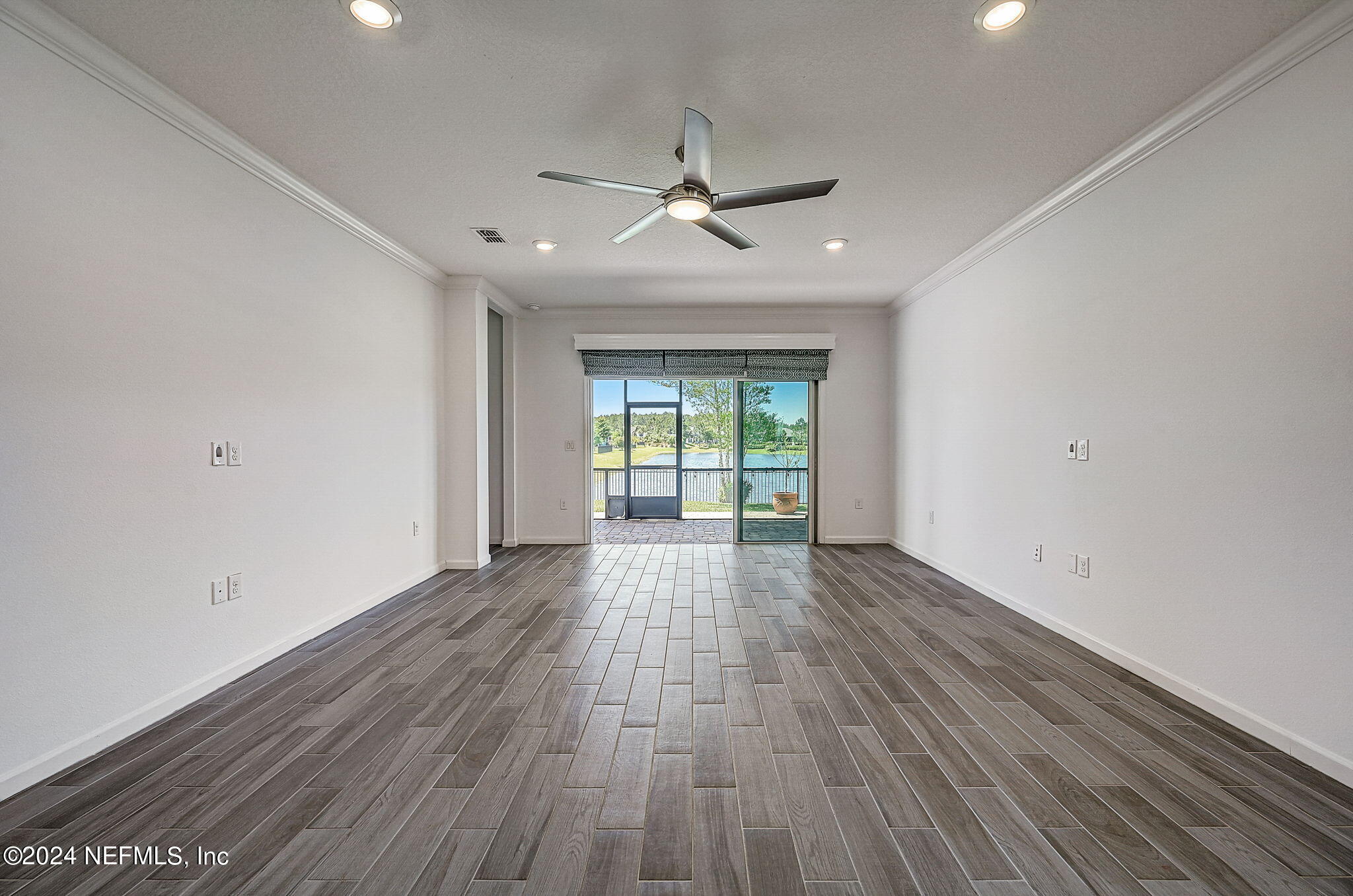48 Martello Drive St. Augustine, FL 32092 - Photo 10 of 50 wooden floor in an empty room with a window