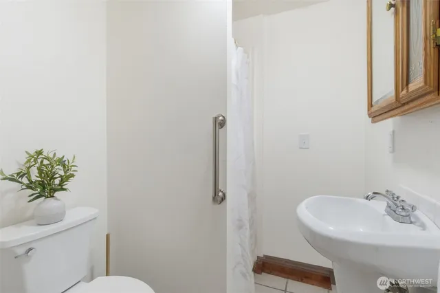 a living room with furniture and large windows