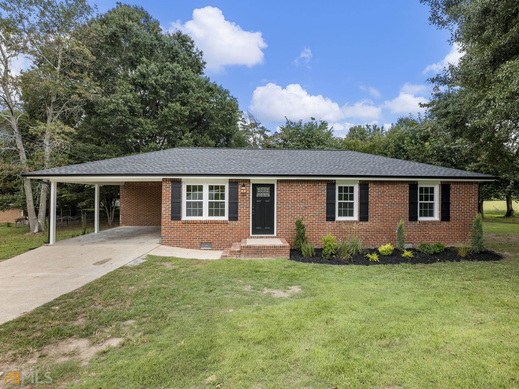 front view of a house with a yard