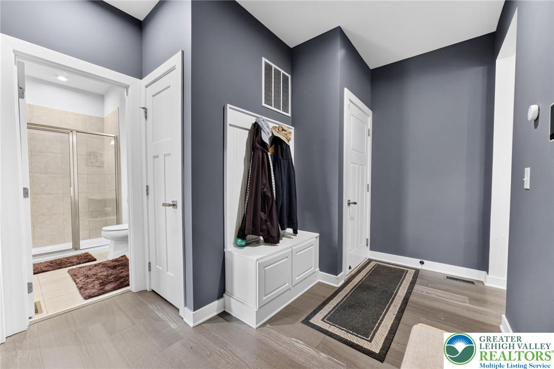 3952 Orth Street Bethlehem, PA 18020 - Photo 16 of 60 Enter a functional mudroom featuring durable flooring and convenient storage leading to a refreshing bathroom.