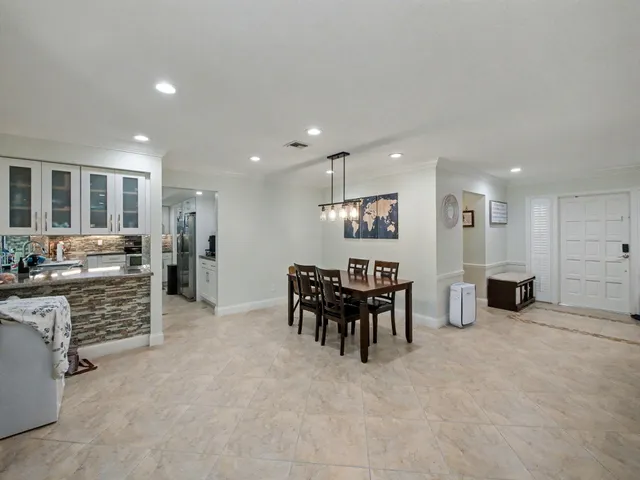 a view of kitchen with furniture and windows