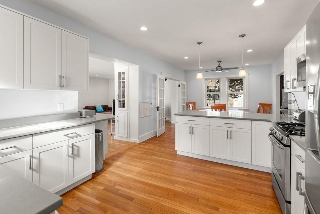 46 Downing Road Lexington, MA 02421 - Photo 11 of 29 a kitchen with stainless steel appliances granite countertop a sink stove and refrigerator