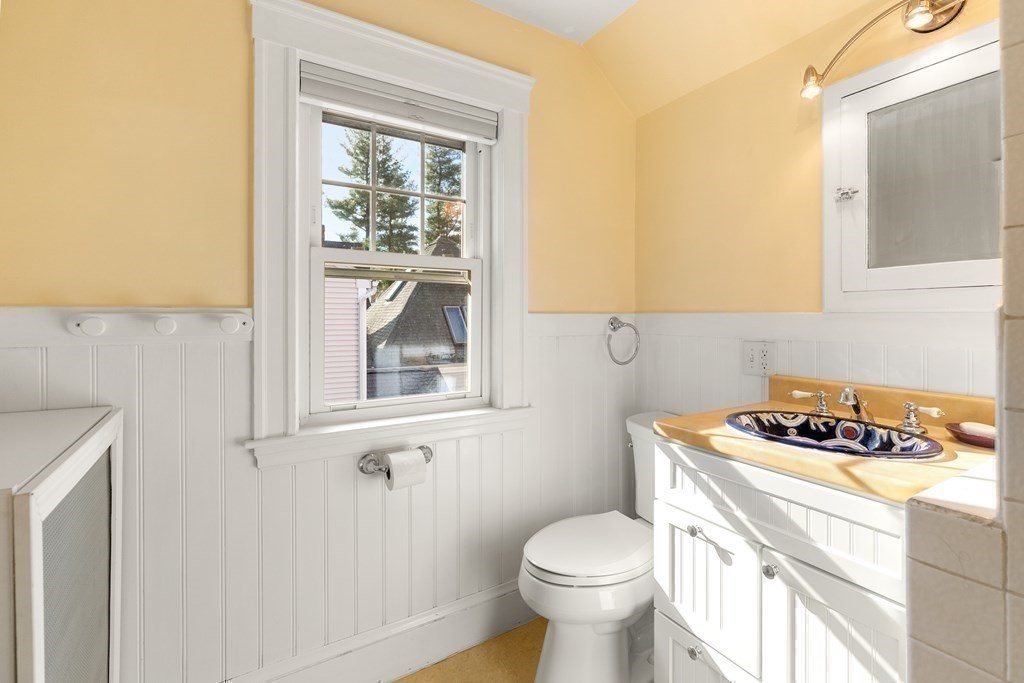 46 Downing Road Lexington, MA 02421 - Photo 20 of 29 a bathroom with a sink a toilet and a window