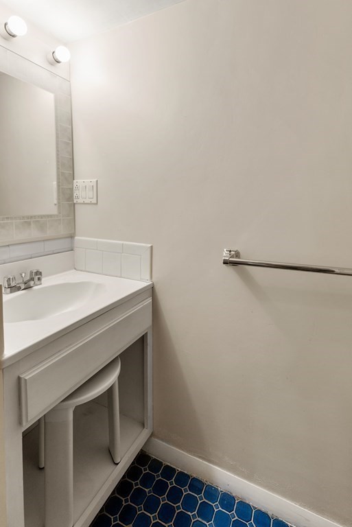 46 Downing Road Lexington, MA 02421 - Photo 23 of 29 a bathroom with a sink and a mirror