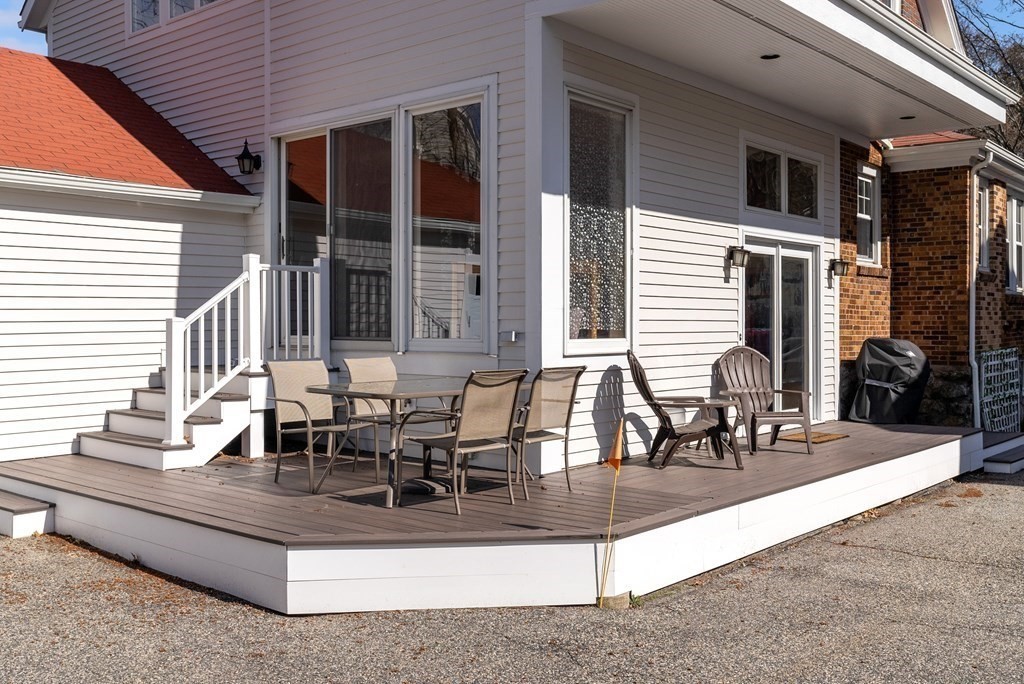 46 Downing Road Lexington, MA 02421 - Photo 27 of 29 a view of a patio with table and chairs