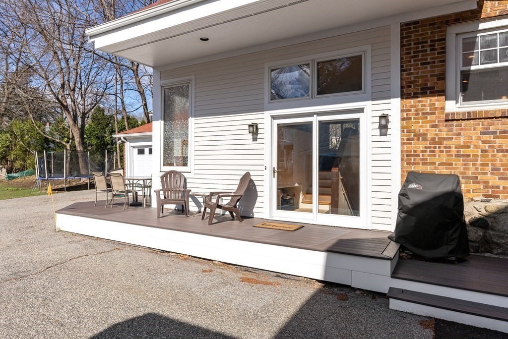46 Downing Road Lexington, MA 02421 - Photo 28 of 29 a view of a patio with couches table and chairs and potted plants