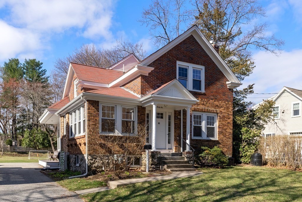 46 Downing Road Lexington, MA 02421 - Photo 29 of 29 a front view of a house with a yard