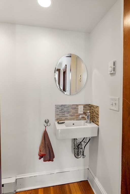 46 Downing Road Lexington, MA 02421 - Photo 5 of 29 a bathroom with a sink and mirror