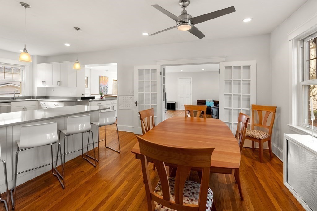 46 Downing Road Lexington, MA 02421 - Photo 7 of 29 a large kitchen with a table and chairs