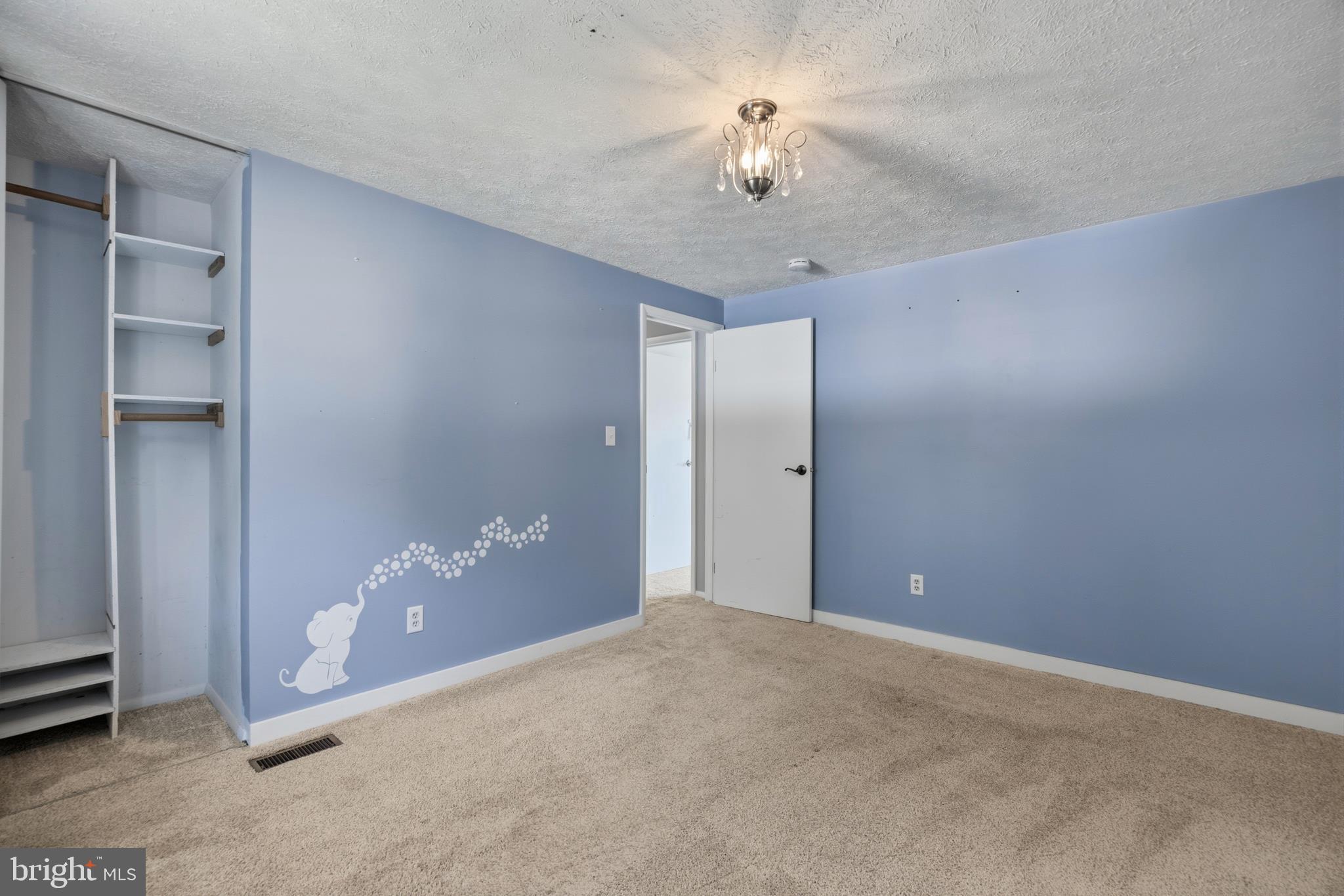 1506 Gollum Road Hanover, MD 21076 - Photo 23 of 44 a view of an empty room with a chandelier fan