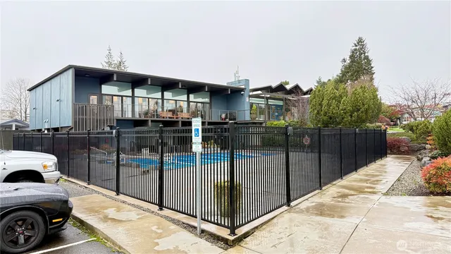 a view of a house with backyard and porch