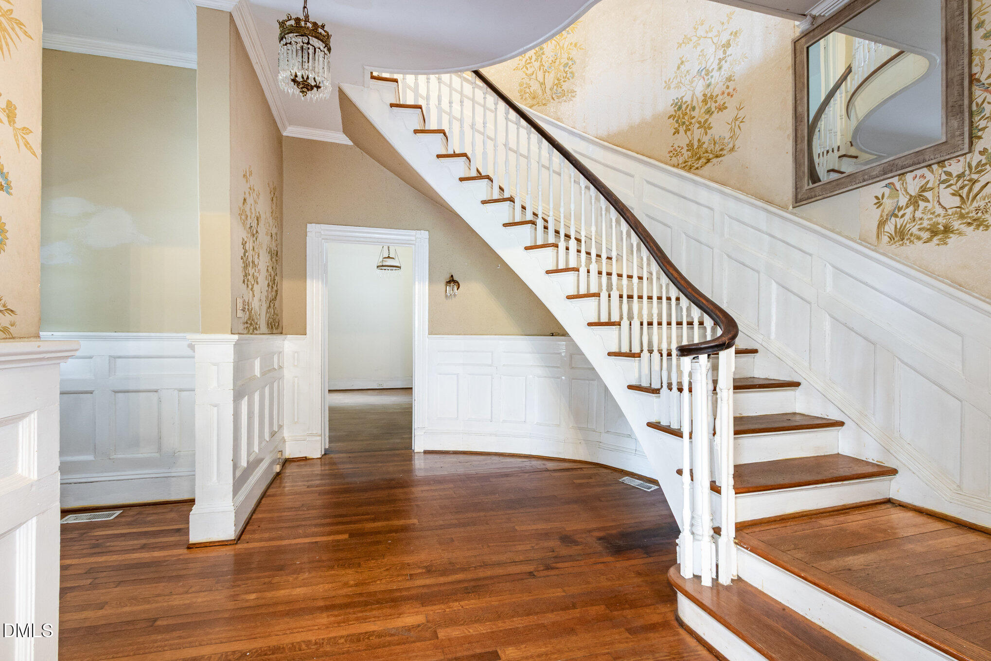 2636 Chapel Hill Road Durham, NC 27707 - Photo 7 of 35 a view of staircase with lots of frames on wall and wooden floor