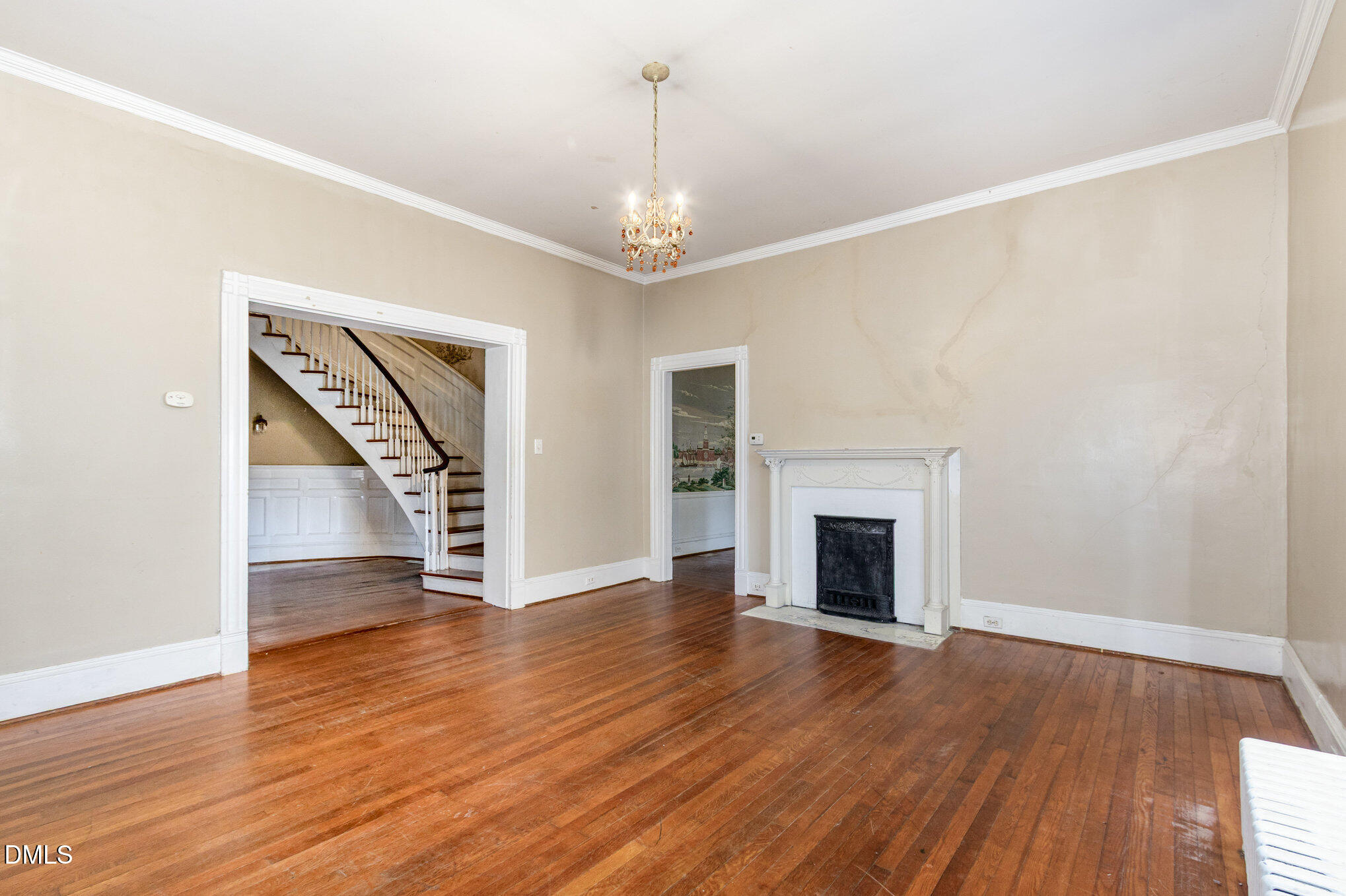 2636 Chapel Hill Road Durham, NC 27707 - Photo 8 of 35 an empty room with wooden floor fireplace and windows