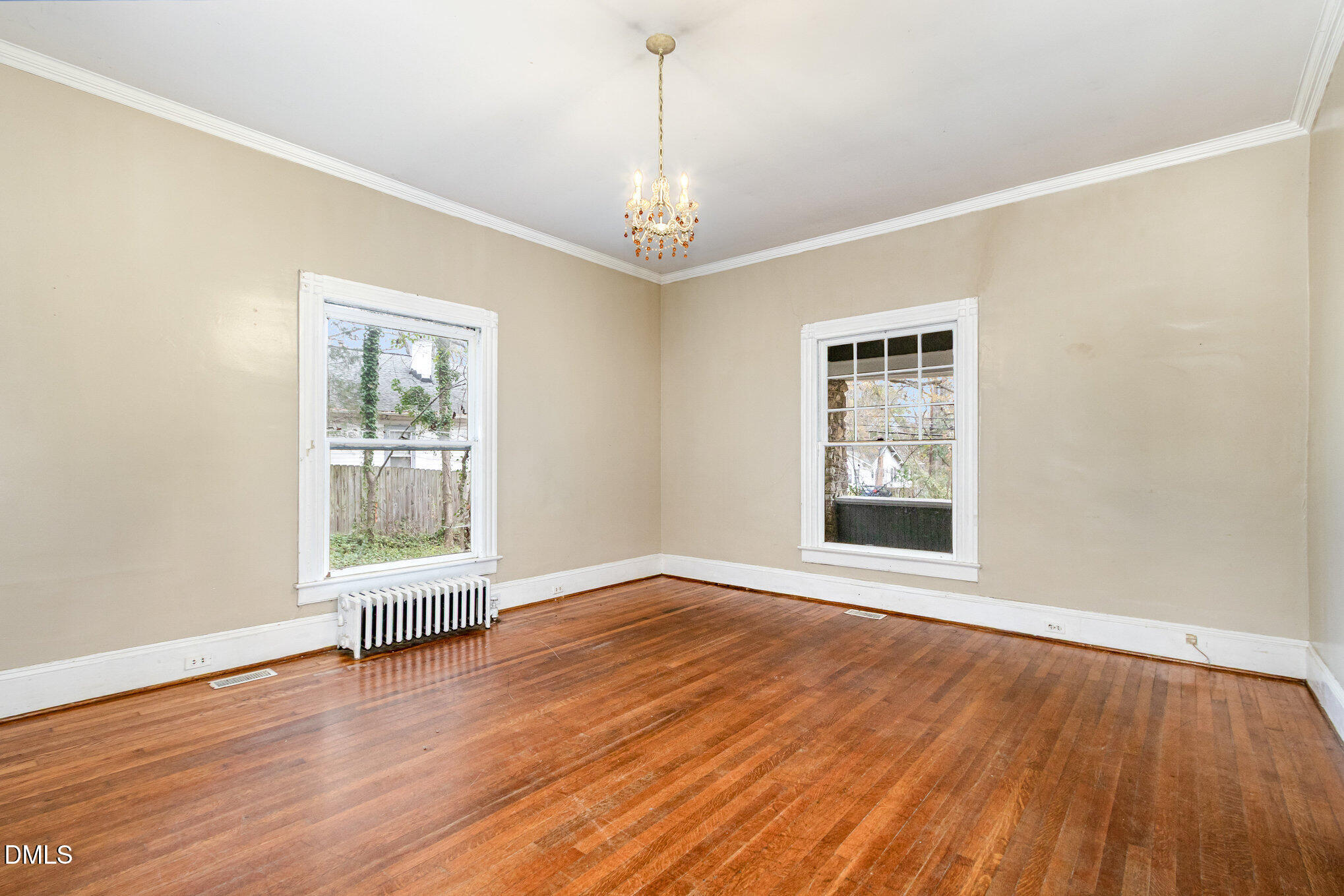 2636 Chapel Hill Road Durham, NC 27707 - Photo 9 of 35 a view of an empty room with wooden floor and a window