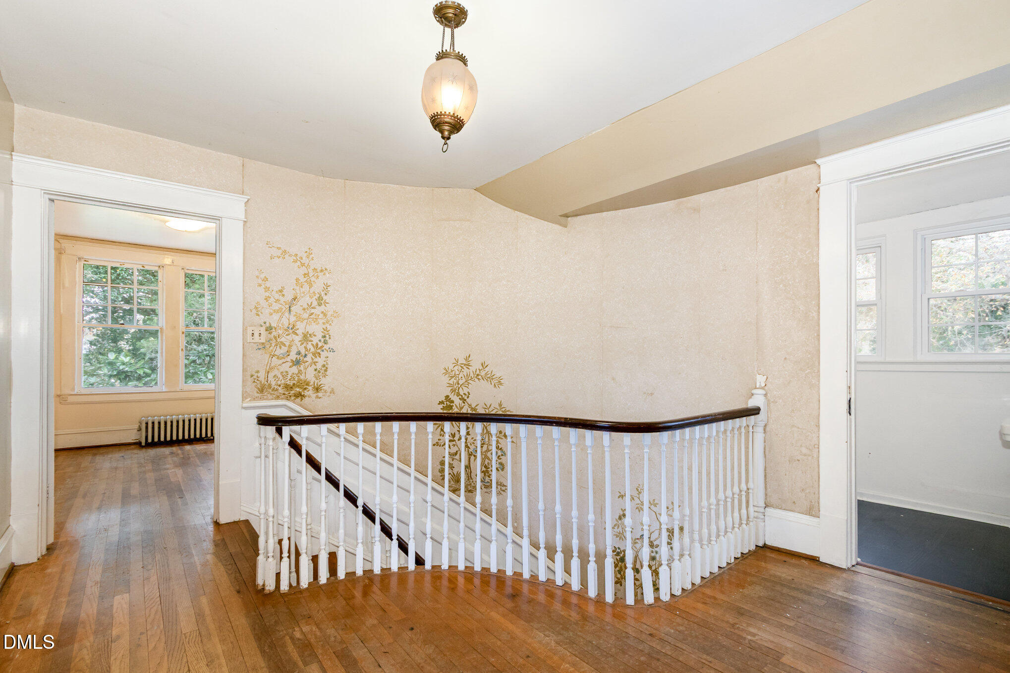 2636 Chapel Hill Road Durham, NC 27707 - Photo 21 of 35 a view of a hallway with wooden floor and stairs
