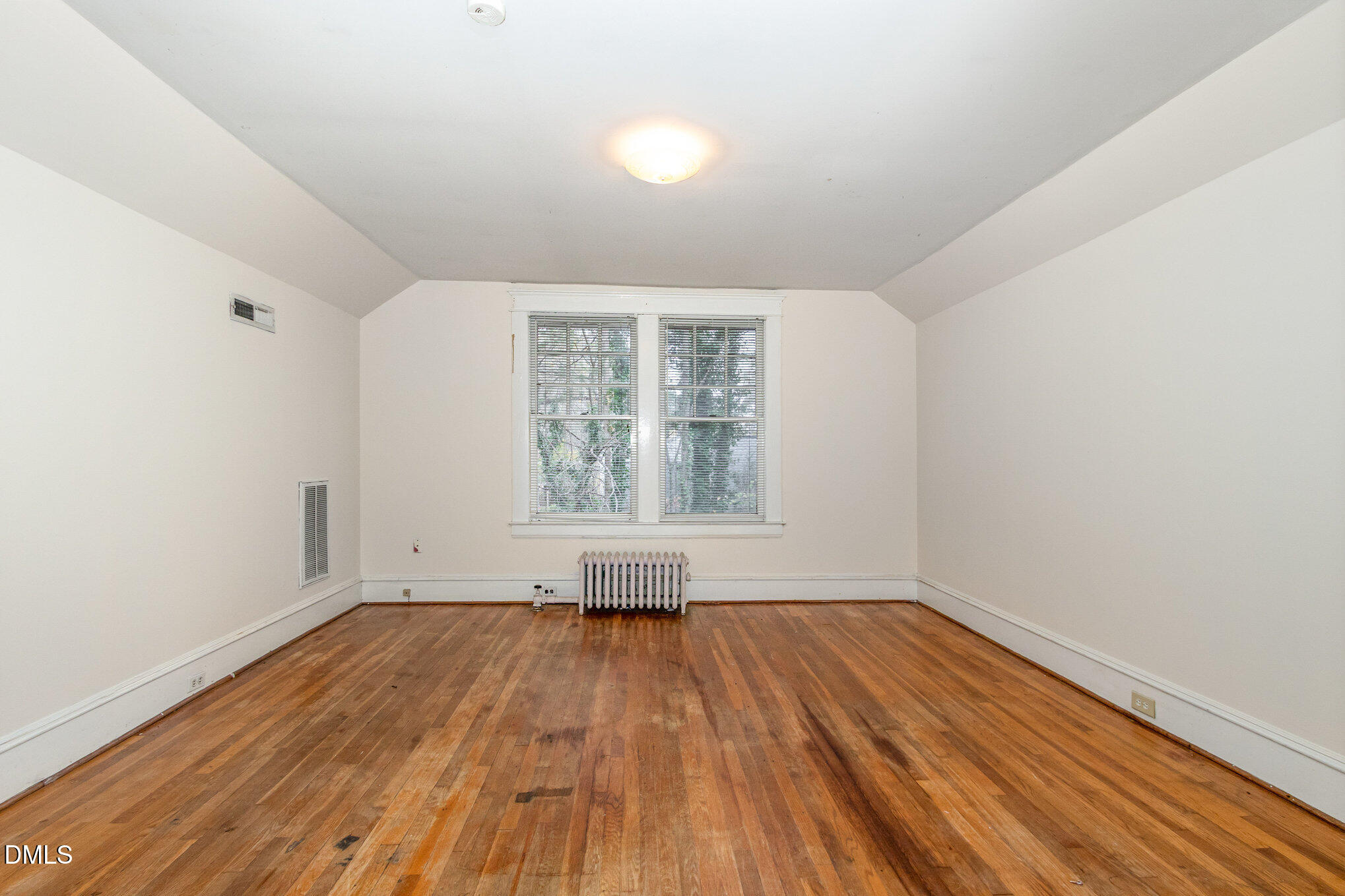 2636 Chapel Hill Road Durham, NC 27707 - Photo 22 of 35 an empty room with wooden floor and windows