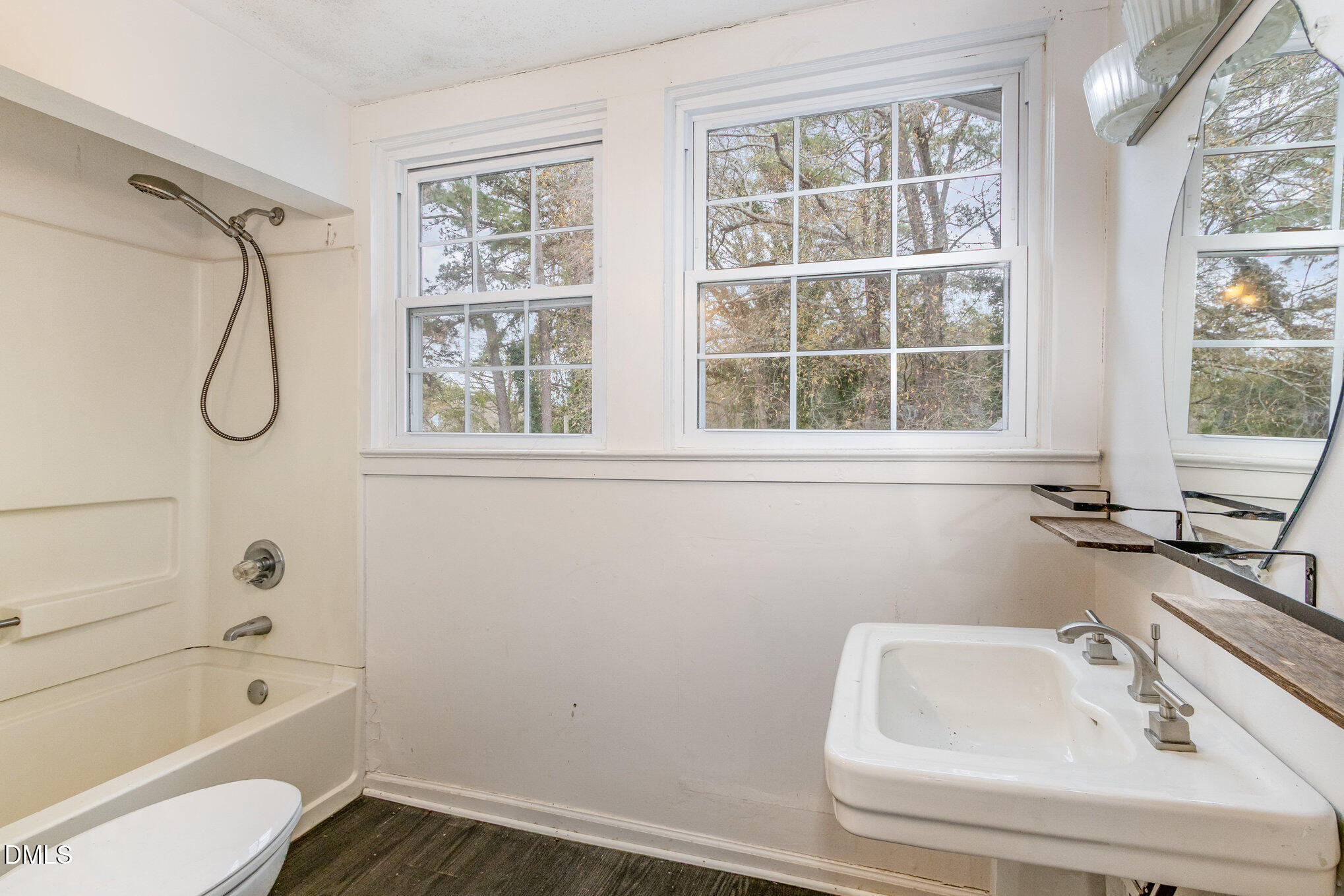 2636 Chapel Hill Road Durham, NC 27707 - Photo 25 of 35 a bathroom with a sink a window and a shower