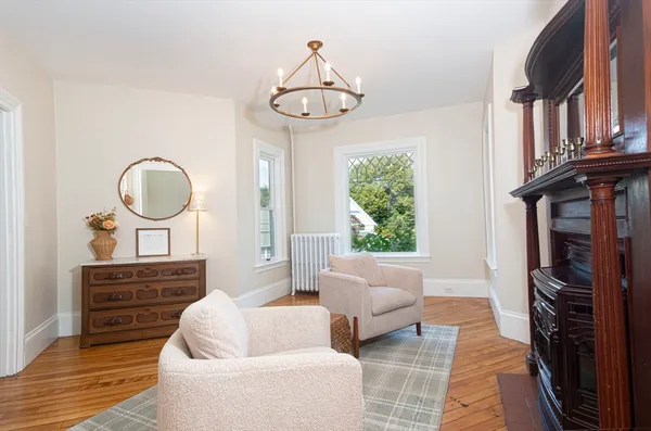 a living room with furniture a window and a fireplace
