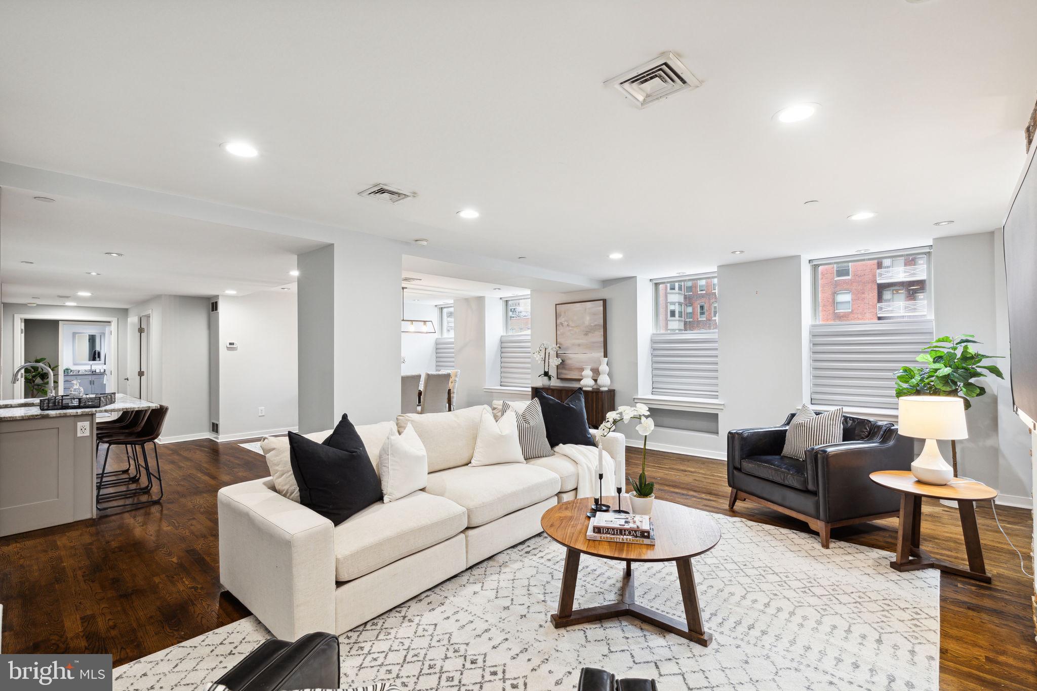 a living room with furniture and a rug
