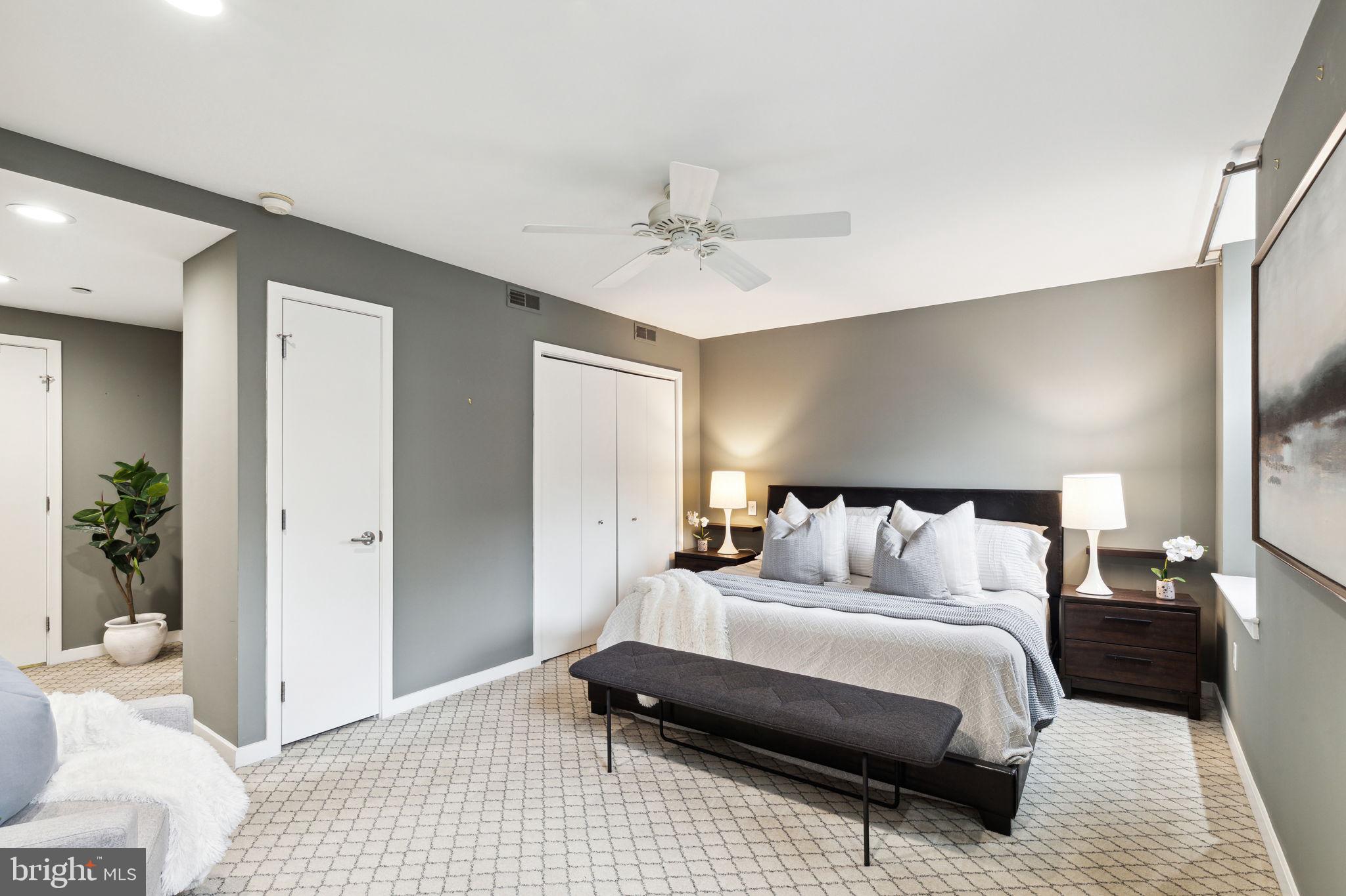 1737 Chestnut Street, Unit 501 Philadelphia, PA 19103 - Photo 13 of 27 a bedroom with a bed and a couch