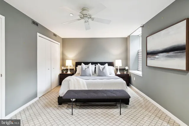 a bedroom with a bed and a mirror