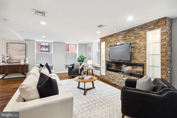 a living room with furniture and a flat screen tv