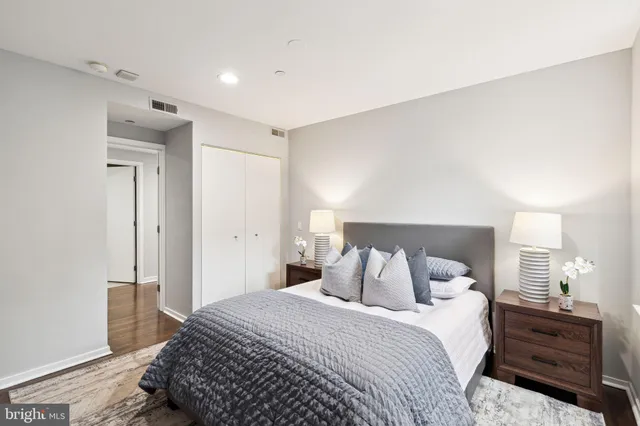 a bedroom with a bed and a closet