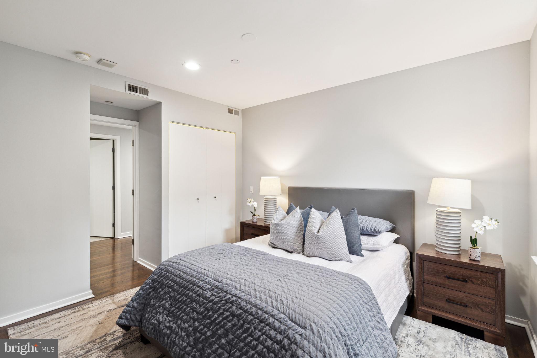 1737 Chestnut Street, Unit 501 Philadelphia, PA 19103 - Photo 21 of 27 a bedroom with a bed and a closet