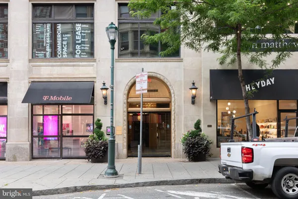a front view of a building with retail shops