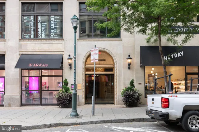 a front view of a building with retail shops