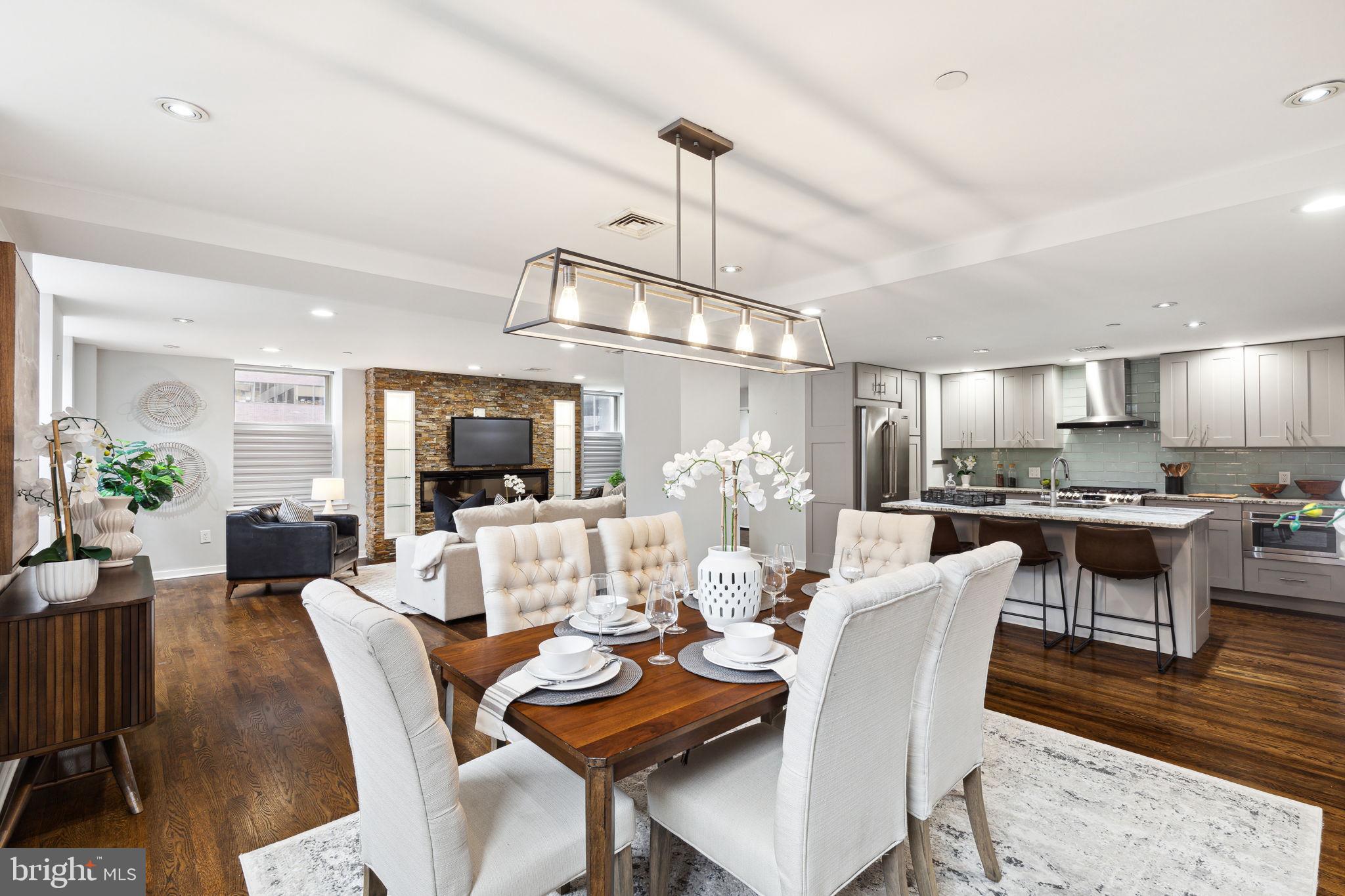 1737 Chestnut Street, Unit 501 Philadelphia, PA 19103 - Photo 6 of 27 a view of a dining room with furniture window and wooden floor