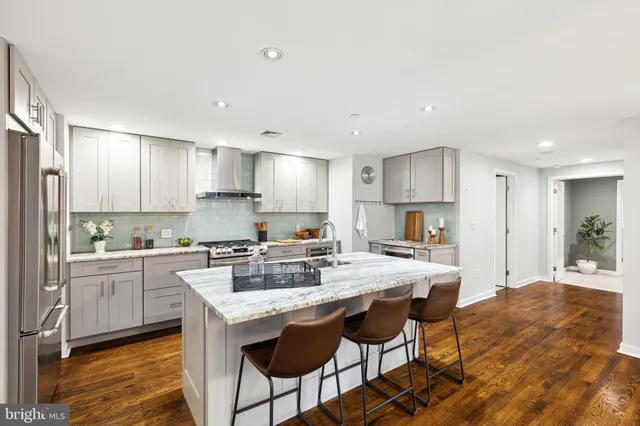 a kitchen with a table and chairs in it