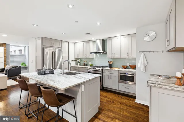 a kitchen with a stove a refrigerator and a refrigerator