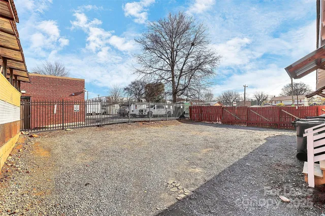 a view of a yard covered with snow in the roadside