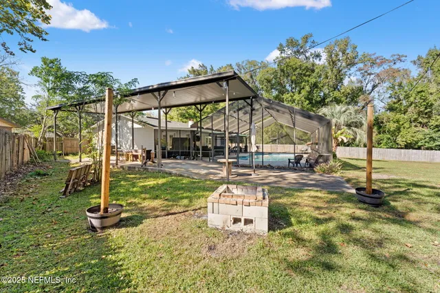 a living room with furniture and a ceiling fan