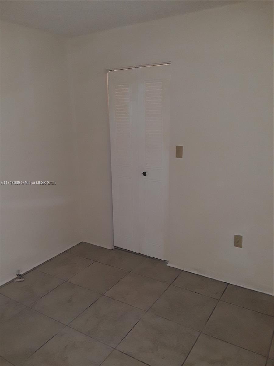 8267 Southwest 128th Street, Unit 105 Pinecrest, FL 33156 - Photo 5 of 5 wooden floor in a bathroom
