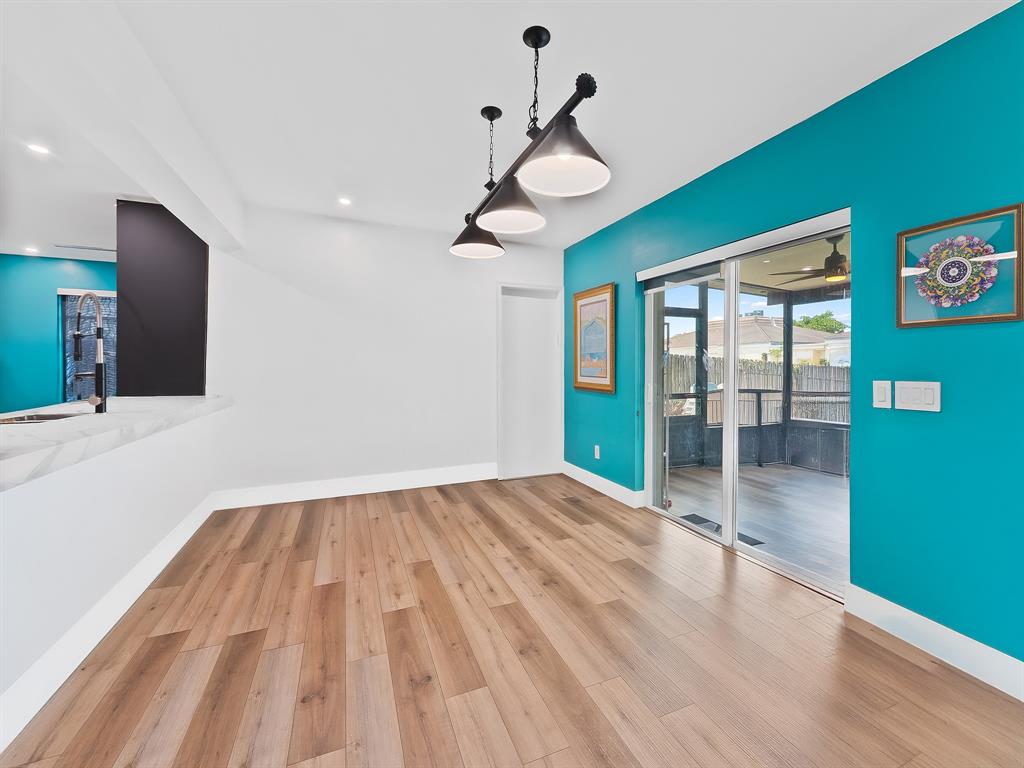 4411 Thomas Street Hollywood, FL 33021 - Photo 11 of 21 a view of an empty room with window and wooden floor