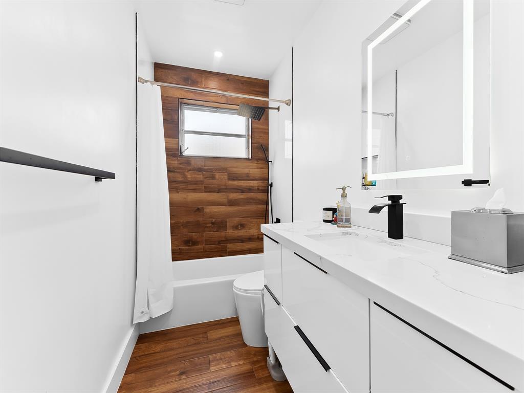 4411 Thomas Street Hollywood, FL 33021 - Photo 15 of 21 a kitchen with a sink a window and cabinets