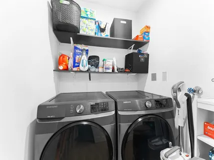 a utility room with dryer and washer