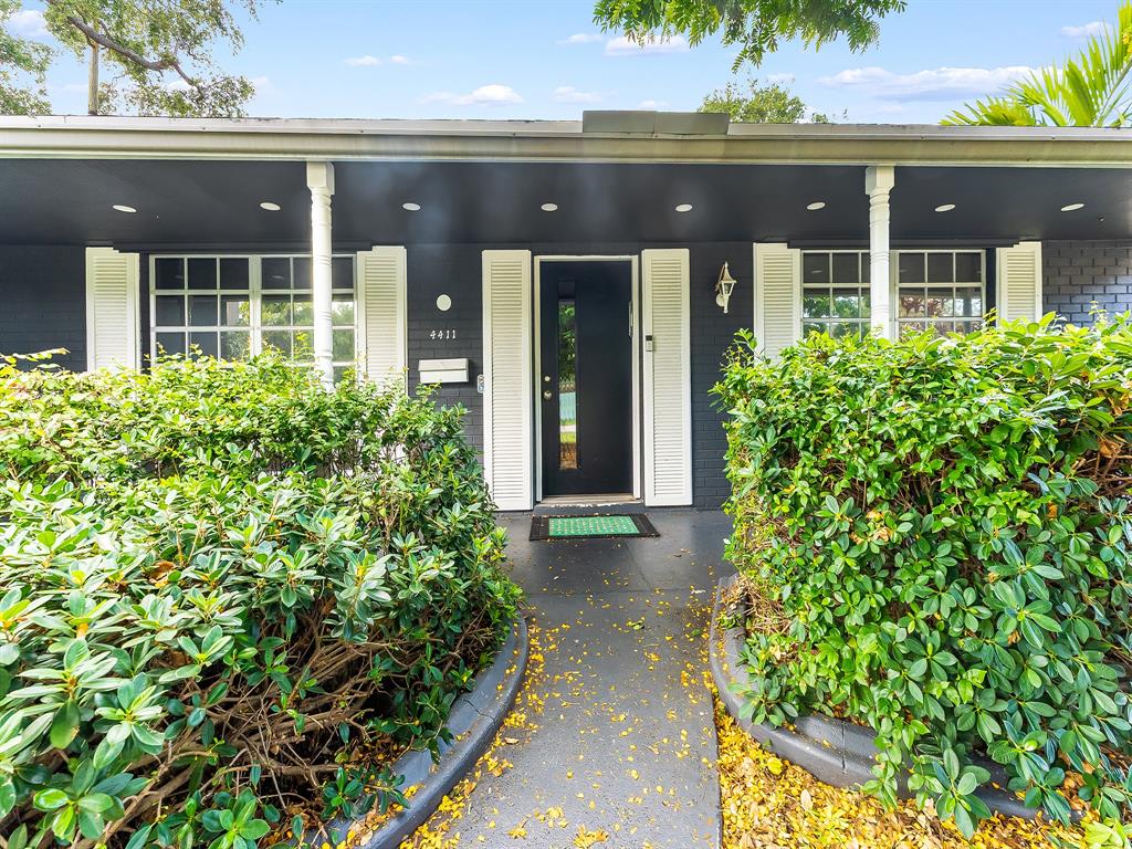 4411 Thomas Street Hollywood, FL 33021 - Photo 20 of 21 a front view of a house with a lots of yellow lighting