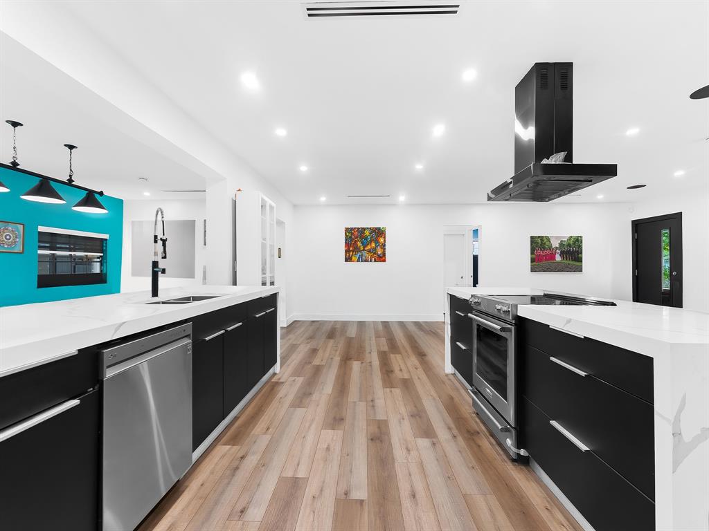 4411 Thomas Street Hollywood, FL 33021 - Photo 6 of 21 a large kitchen with stainless steel appliances granite countertop a stove and a sink